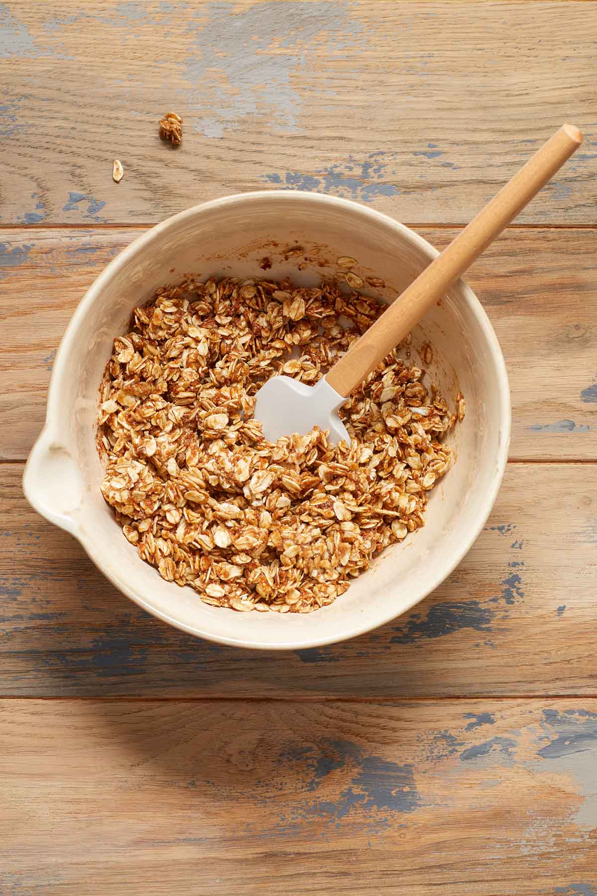 Oat filling mixed together in a bowl with a spatula.