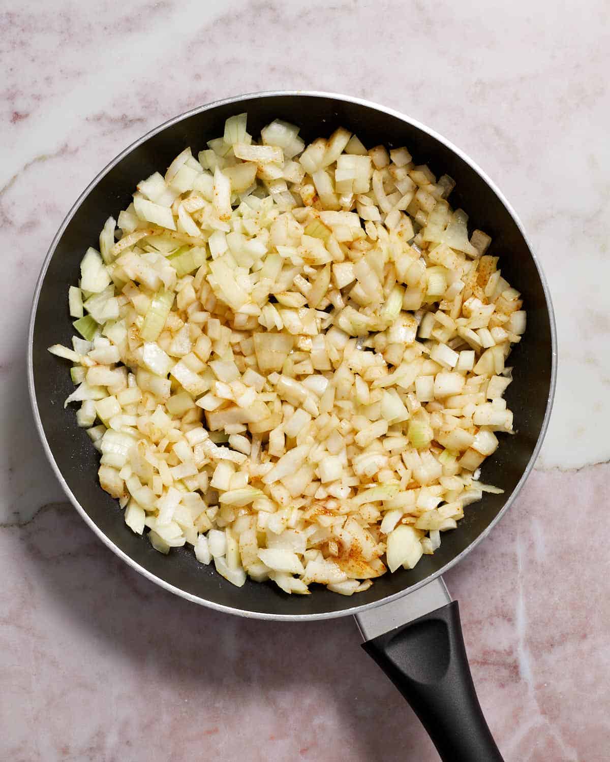 Chopped onions in a skillet.