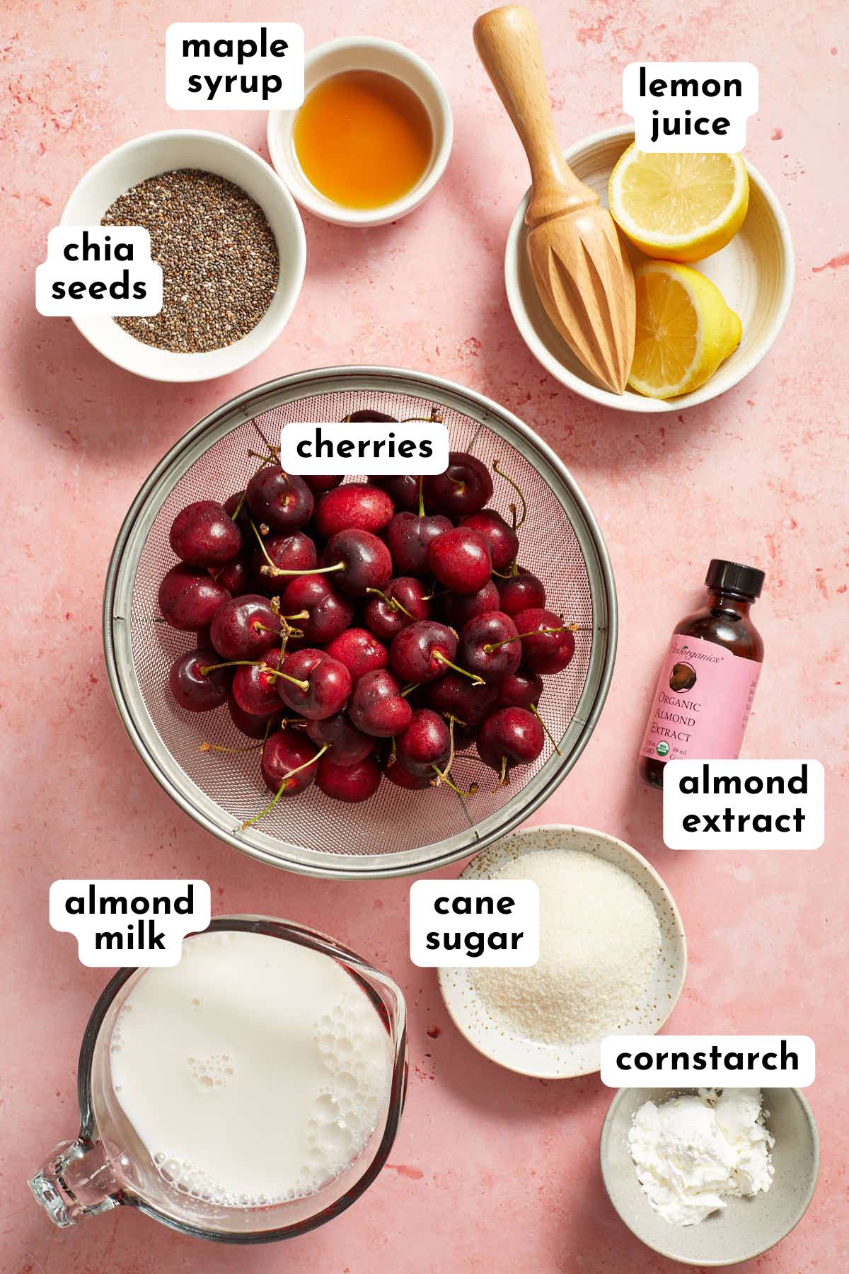 Cherry chia pudding ingredients arranged individually and labeled.