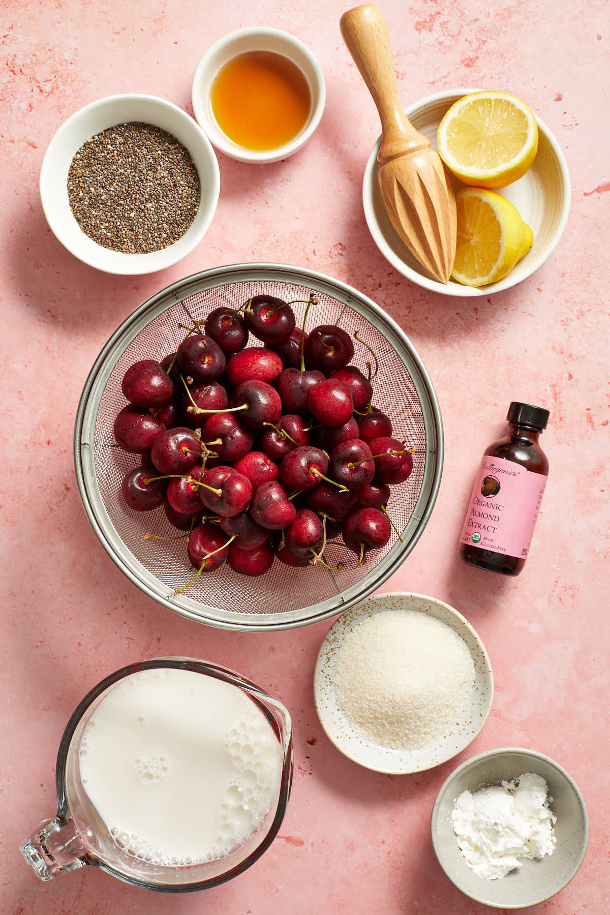 Ingredients to make cherry chia pudding arranged individually.