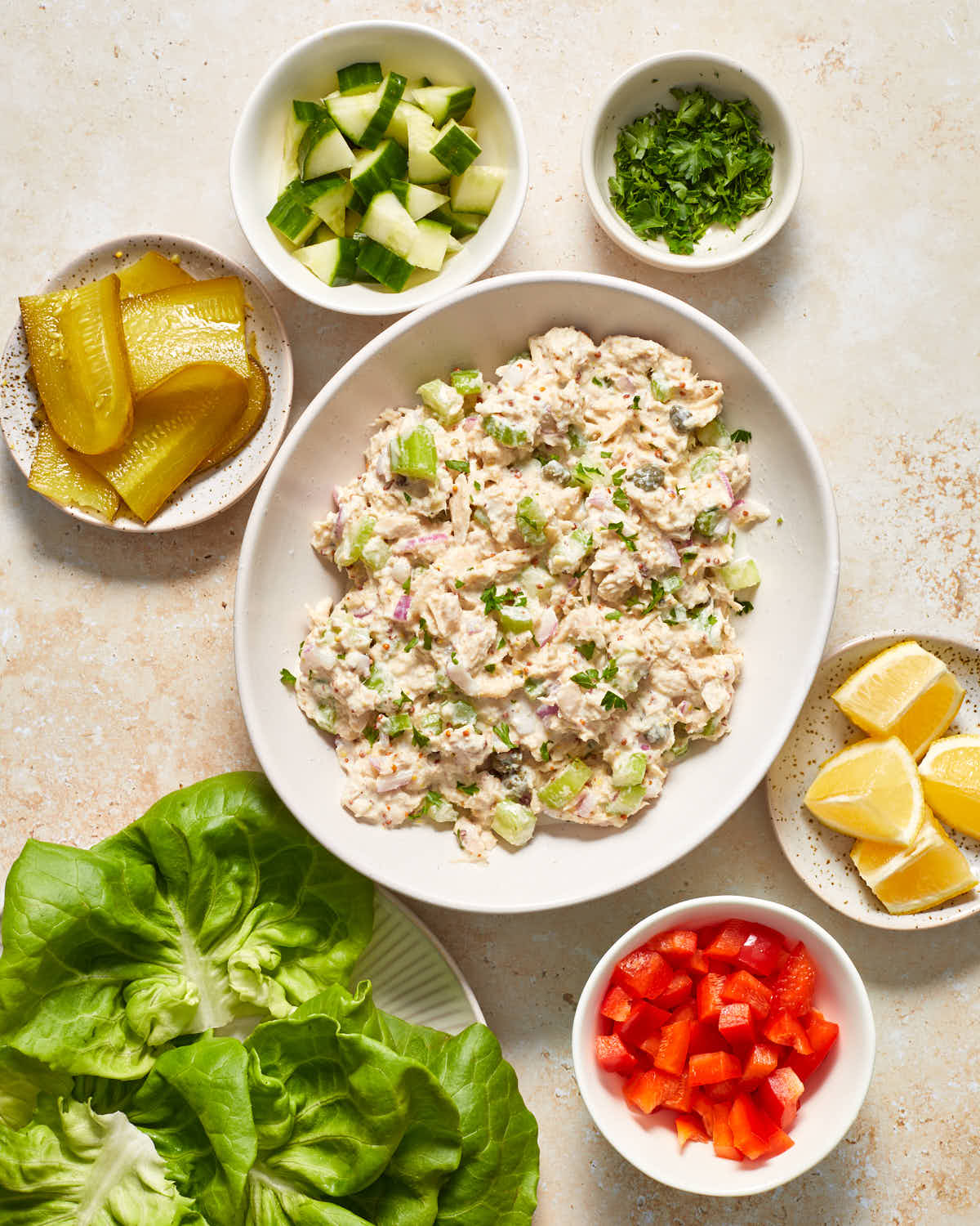 Ingredients to make tuna salad lettuce wraps arranged individually.