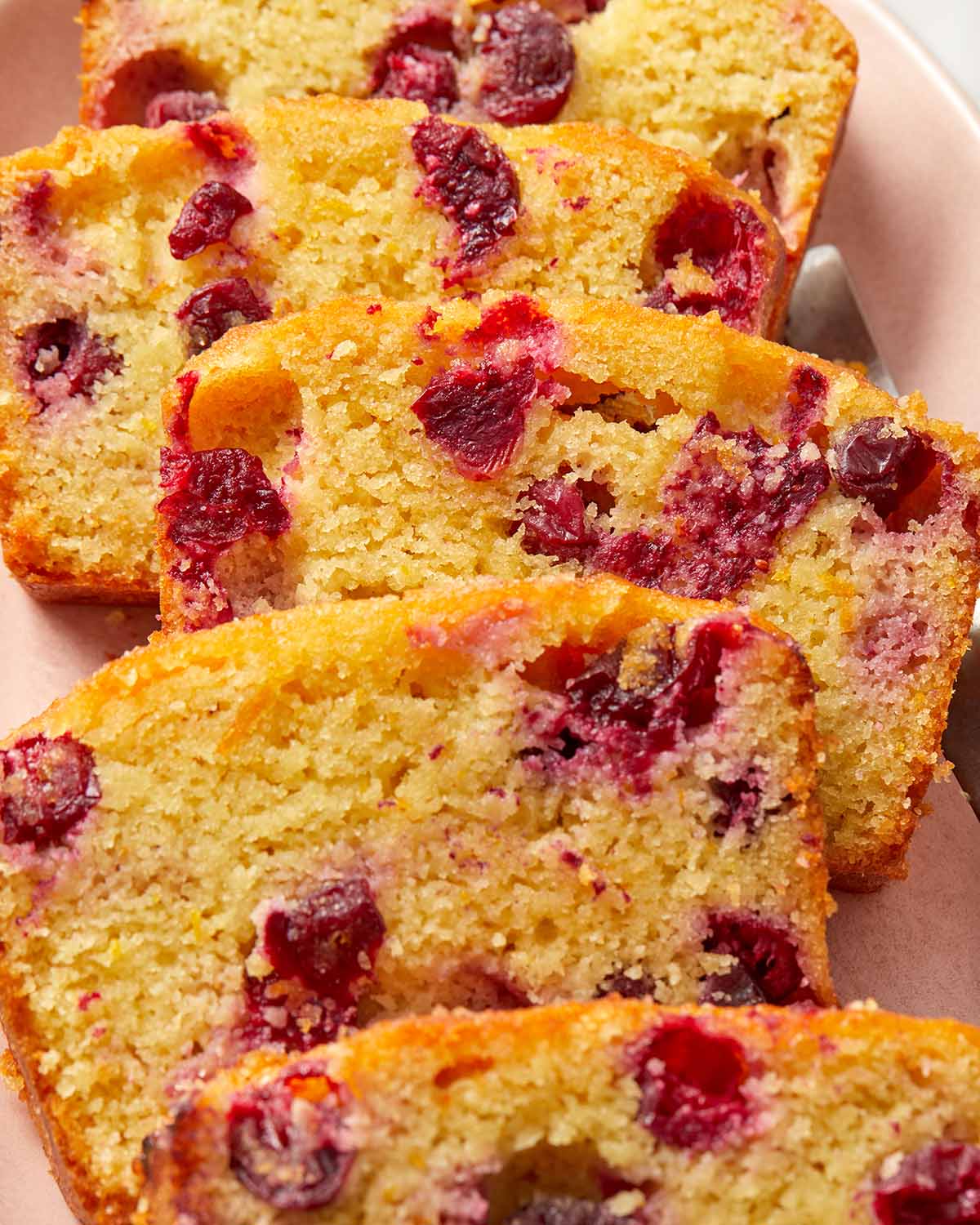 Close up of slices of cranberry bread.