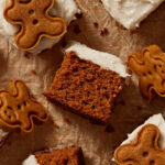 Pieces of almond flour gingerbread cake arranged on brown crumpled parchment paper.