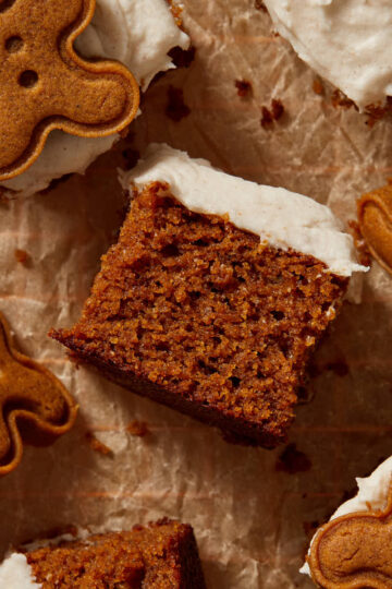 Pieces of almond flour gingerbread cake arranged on brown crumpled parchment paper.