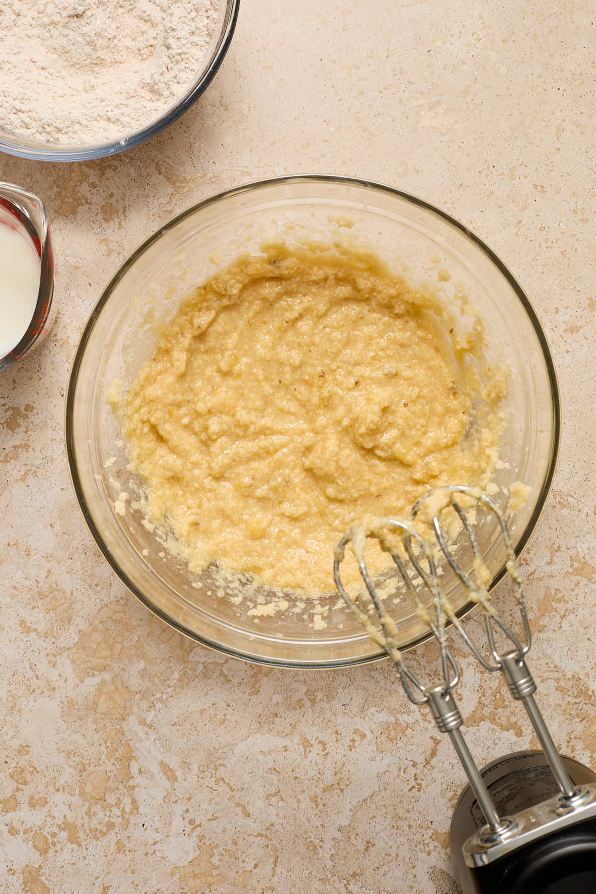 Wet ingredients mixed together with milk and flour mixture on the side.