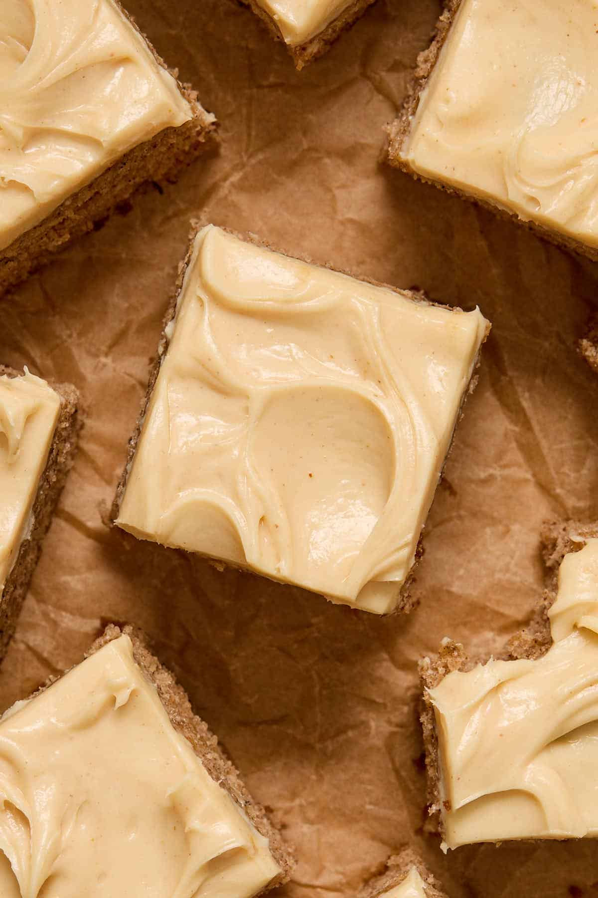 Overhead view of a piece of cake topped with peanut butter frosting.