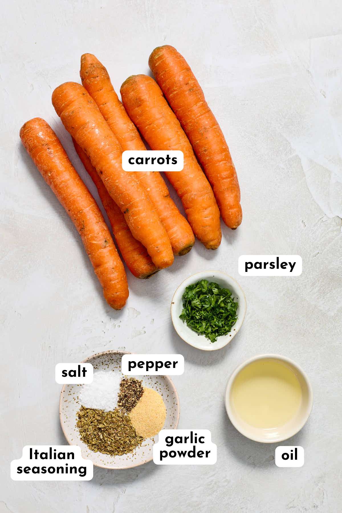Ingredients to make air fryer carrots arranged individually and labeled.