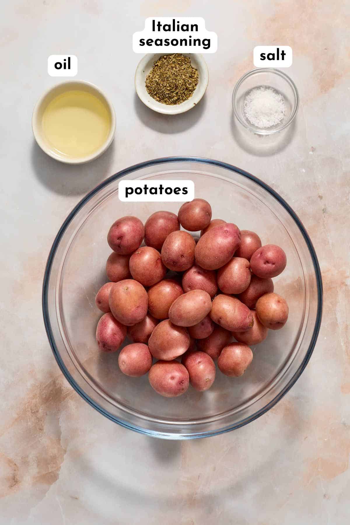 Ingredients to make air fryer baby potatoes arranged individually and labeled.