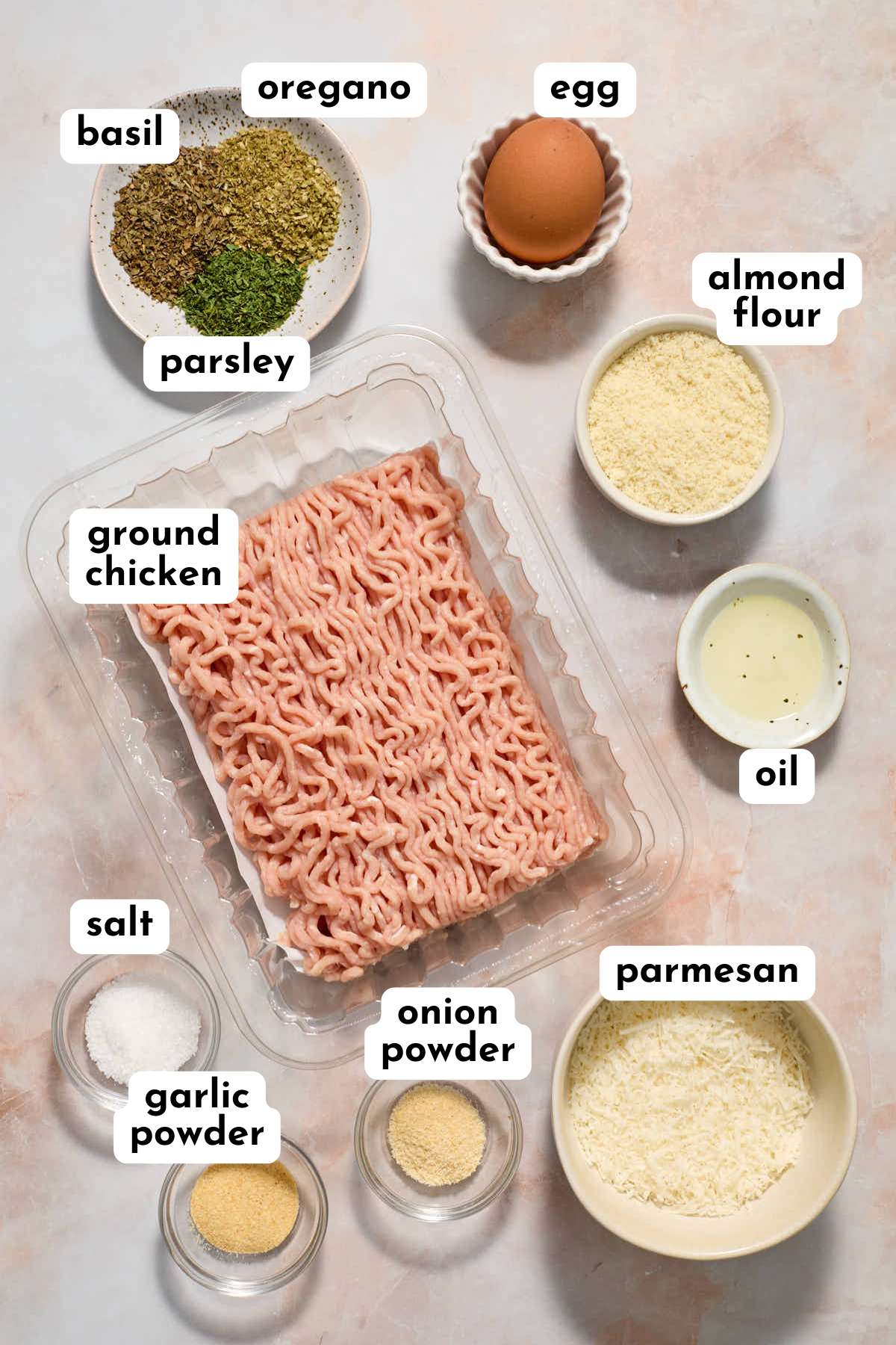 Ingredients for making air fryer chicken meatballs arranged individually and labeled.