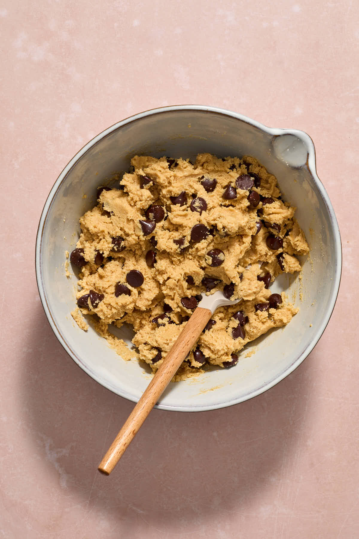 Chocolate chips folded into the batter with a spatula.