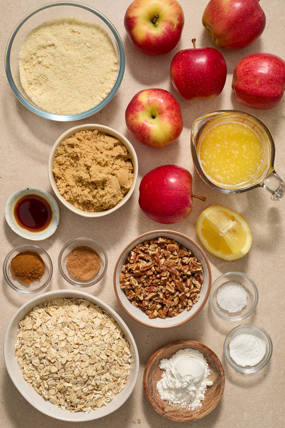 Ingredients to make apple crisp arranged individually.