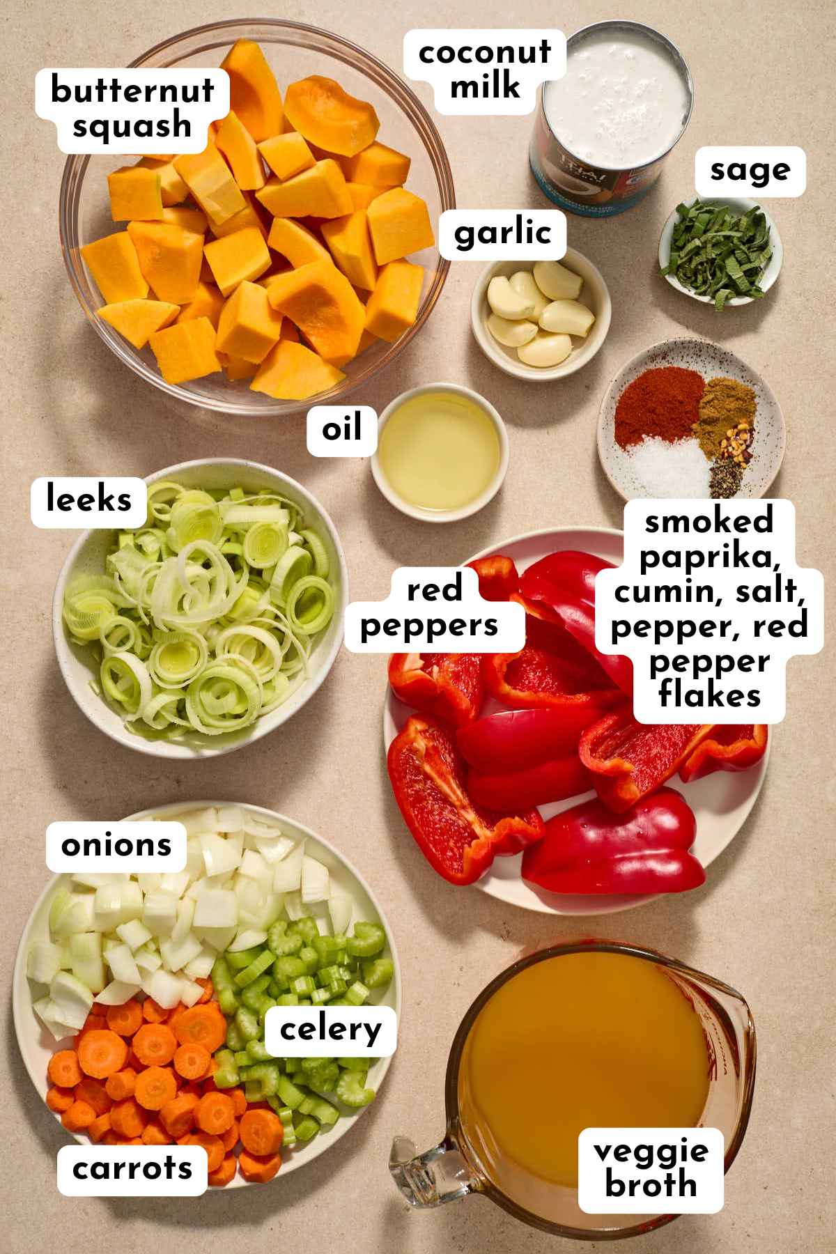 Ingredients for red pepper squash soup arranged individually and labeled.