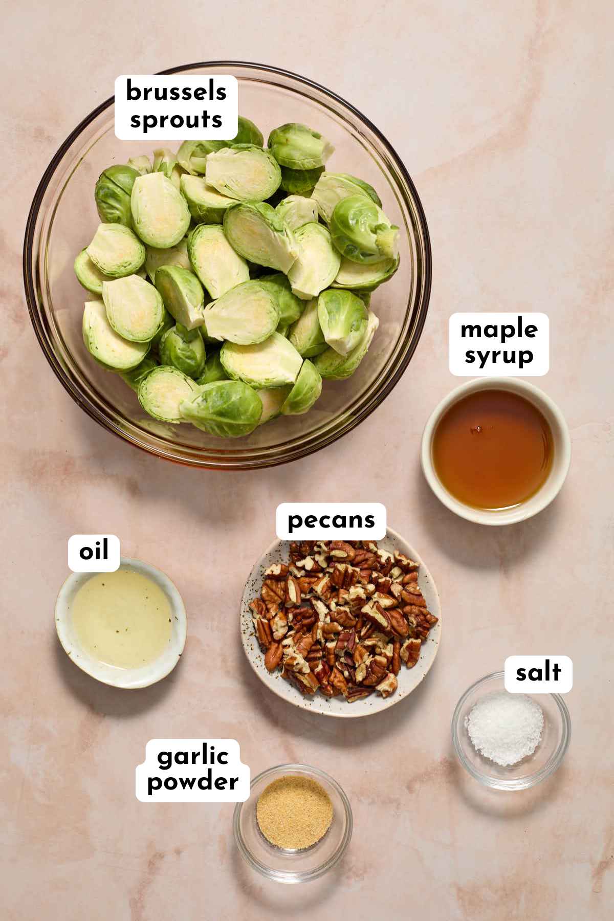Ingredients for air fryer Brussels sprouts arranged individually and labeled.