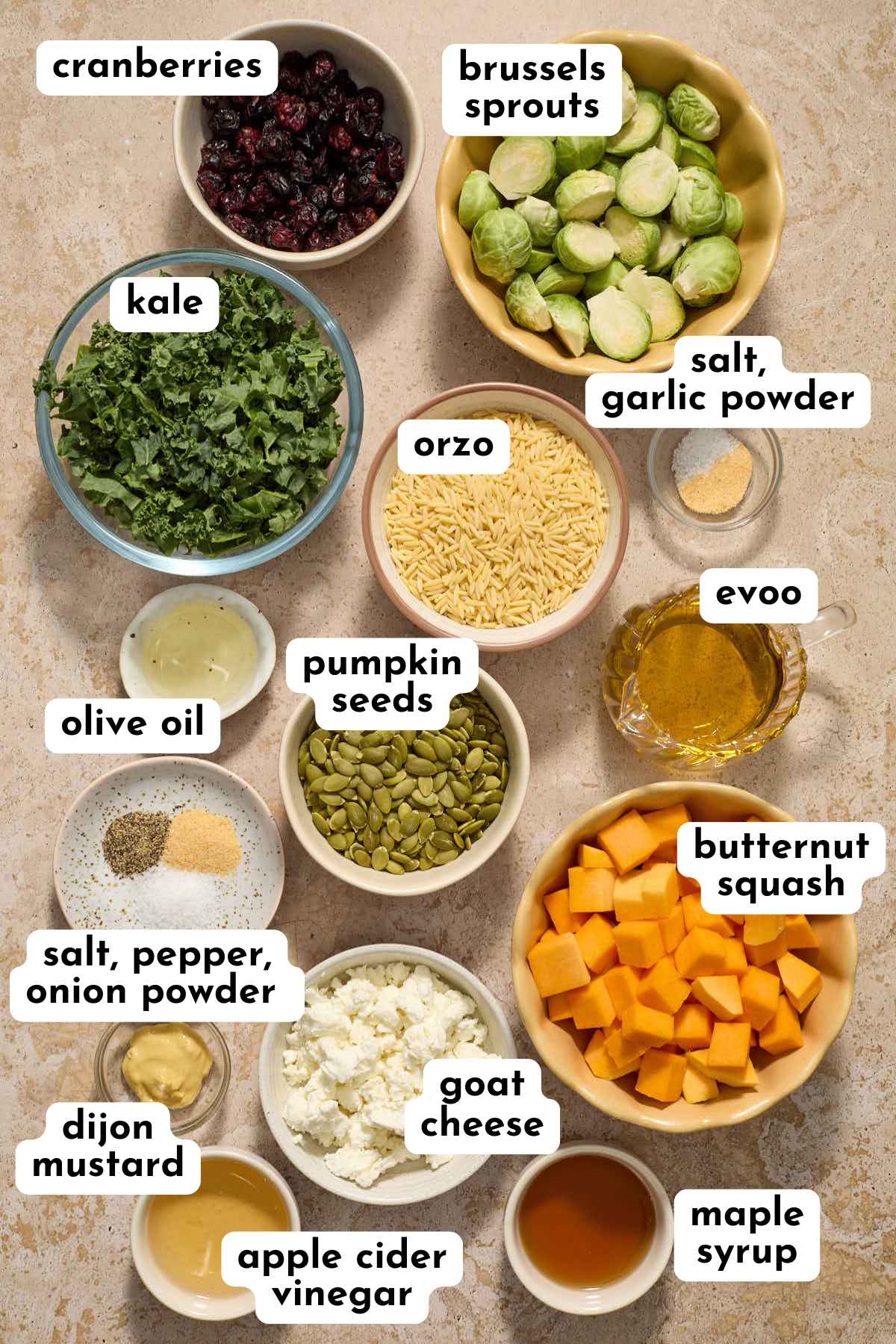 Ingredients for making a fall orzo salad arranged individually and labeled.