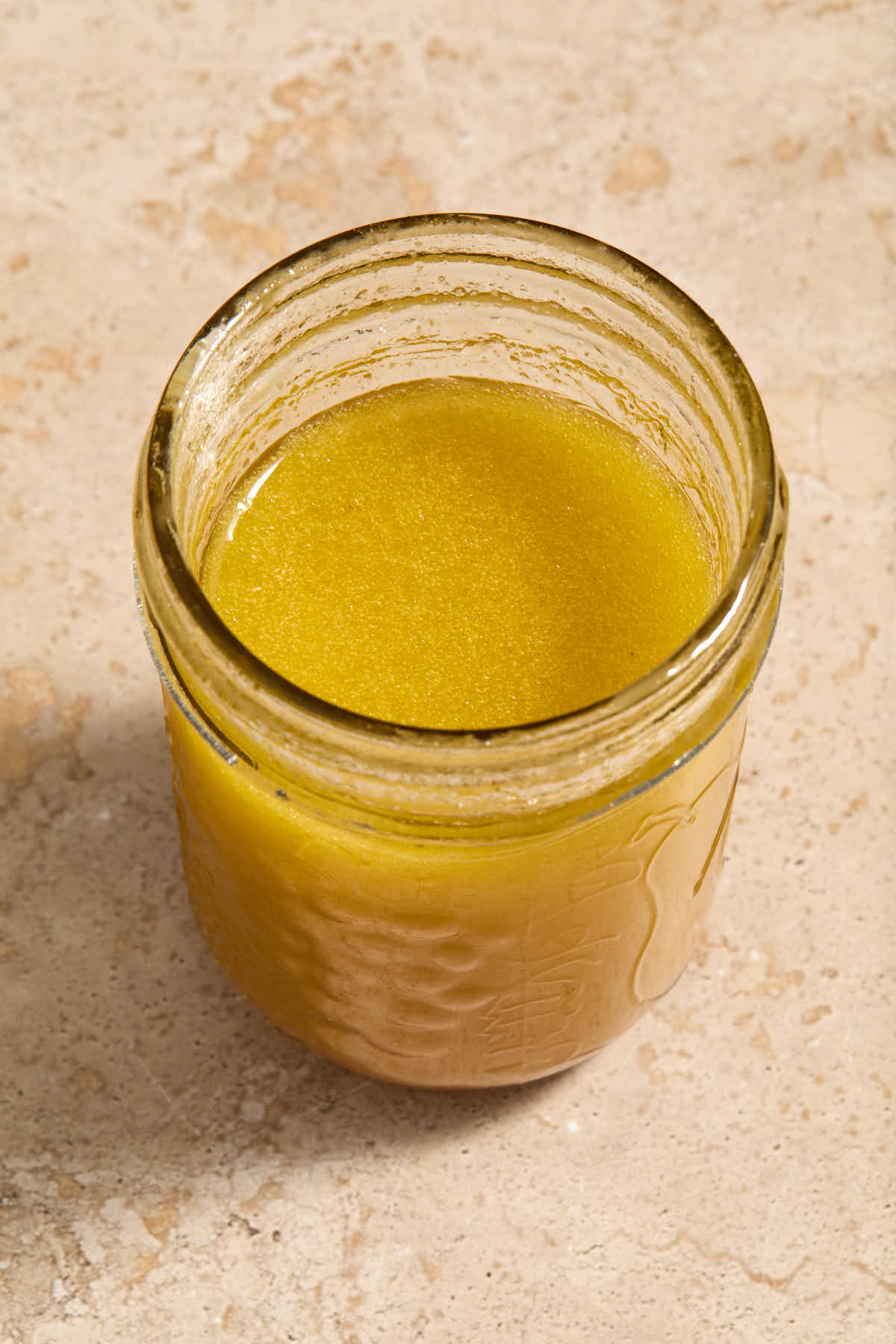 Apple cider vinaigrette mixed together in a glass jar.