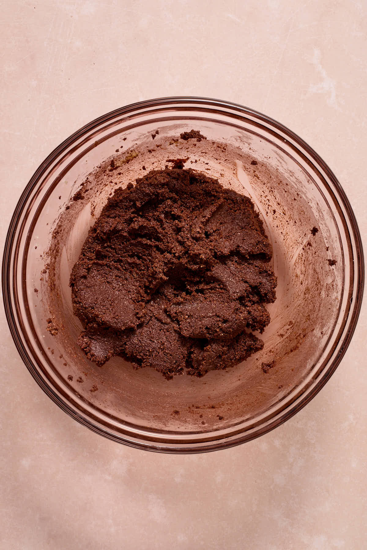 Cookie dough fully mixed together in a glass bowl.