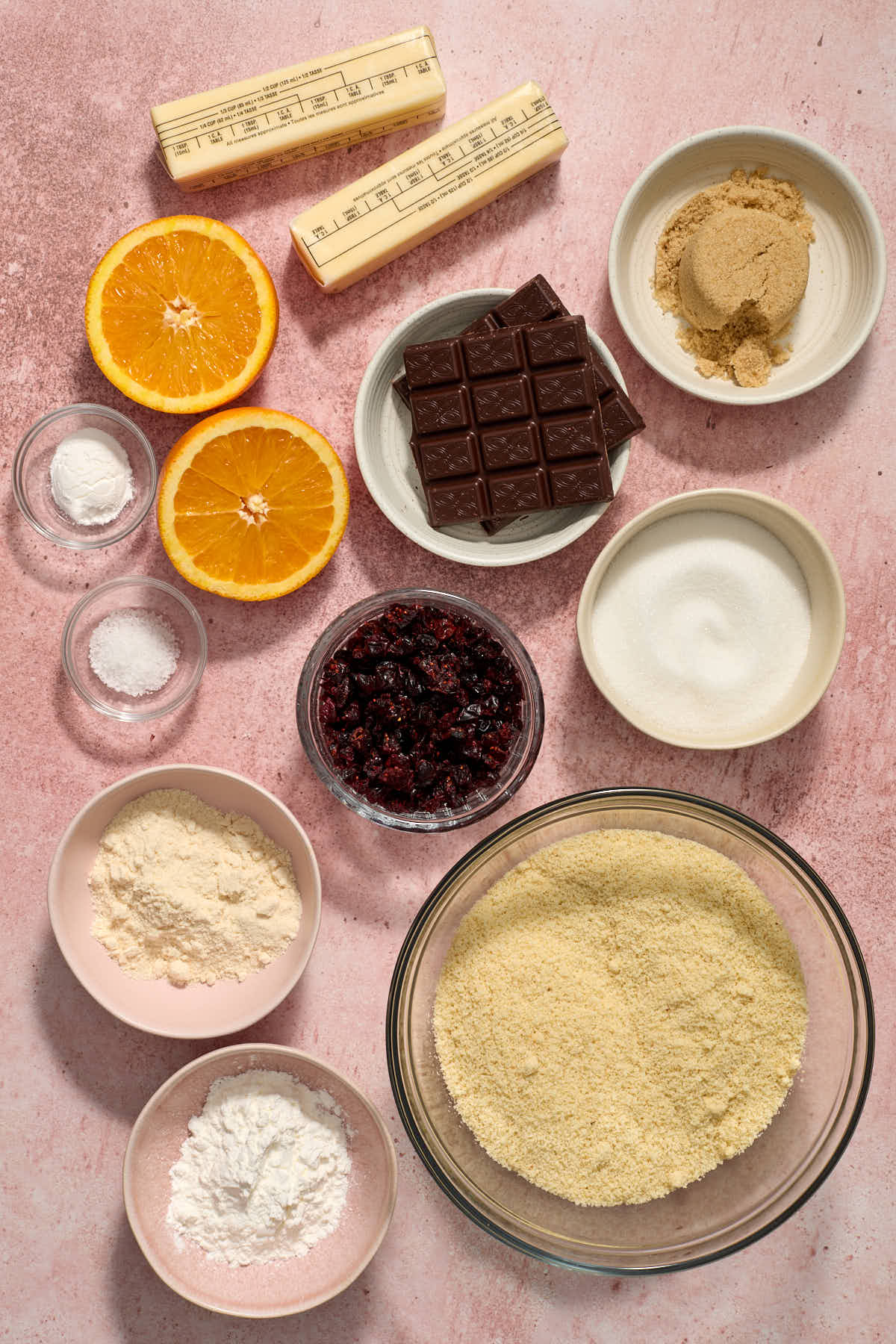 Ingredients to make almond flour orange cranberry icebox cookies arranged individually.