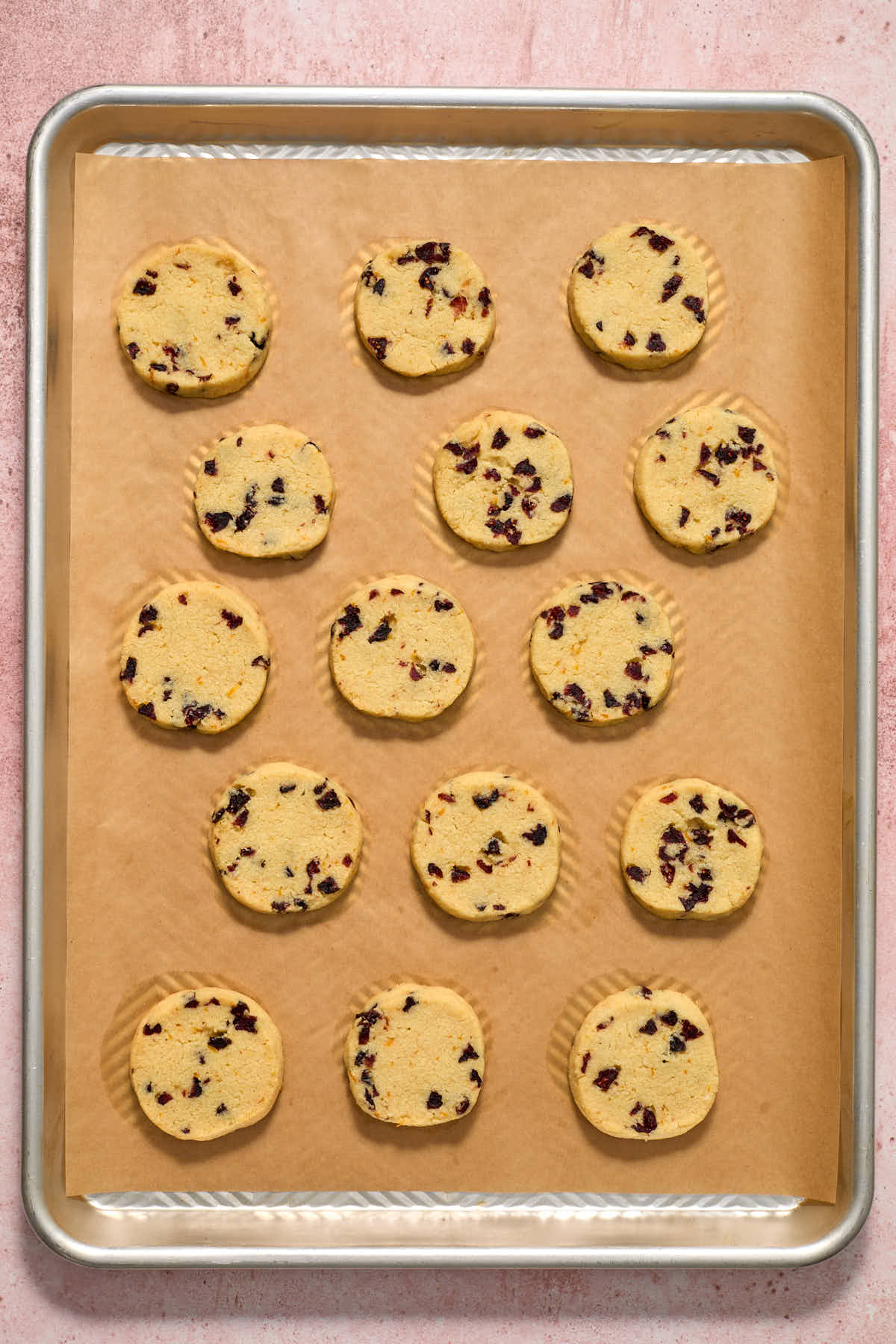 Cookies baked and cooling on the baking sheet.