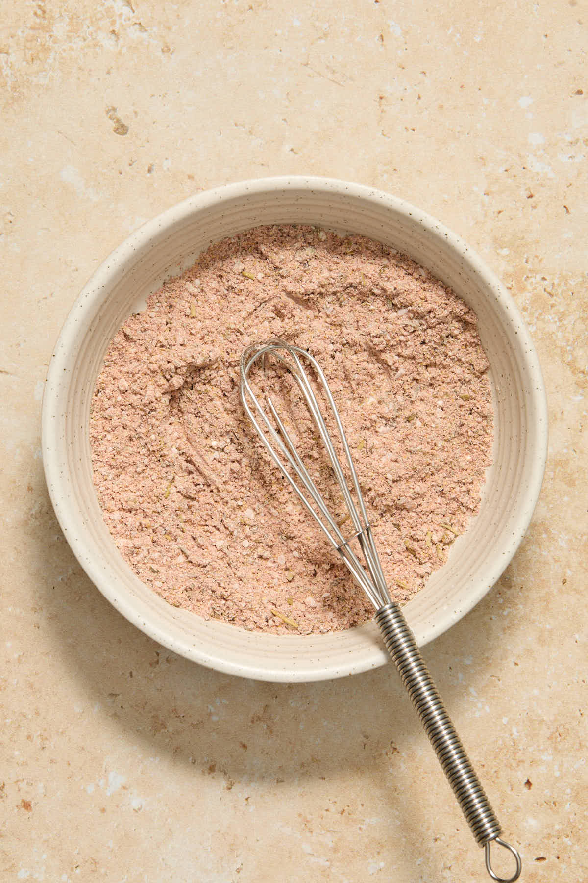 Cornstarch and seasonings whisked together in a small bowl.