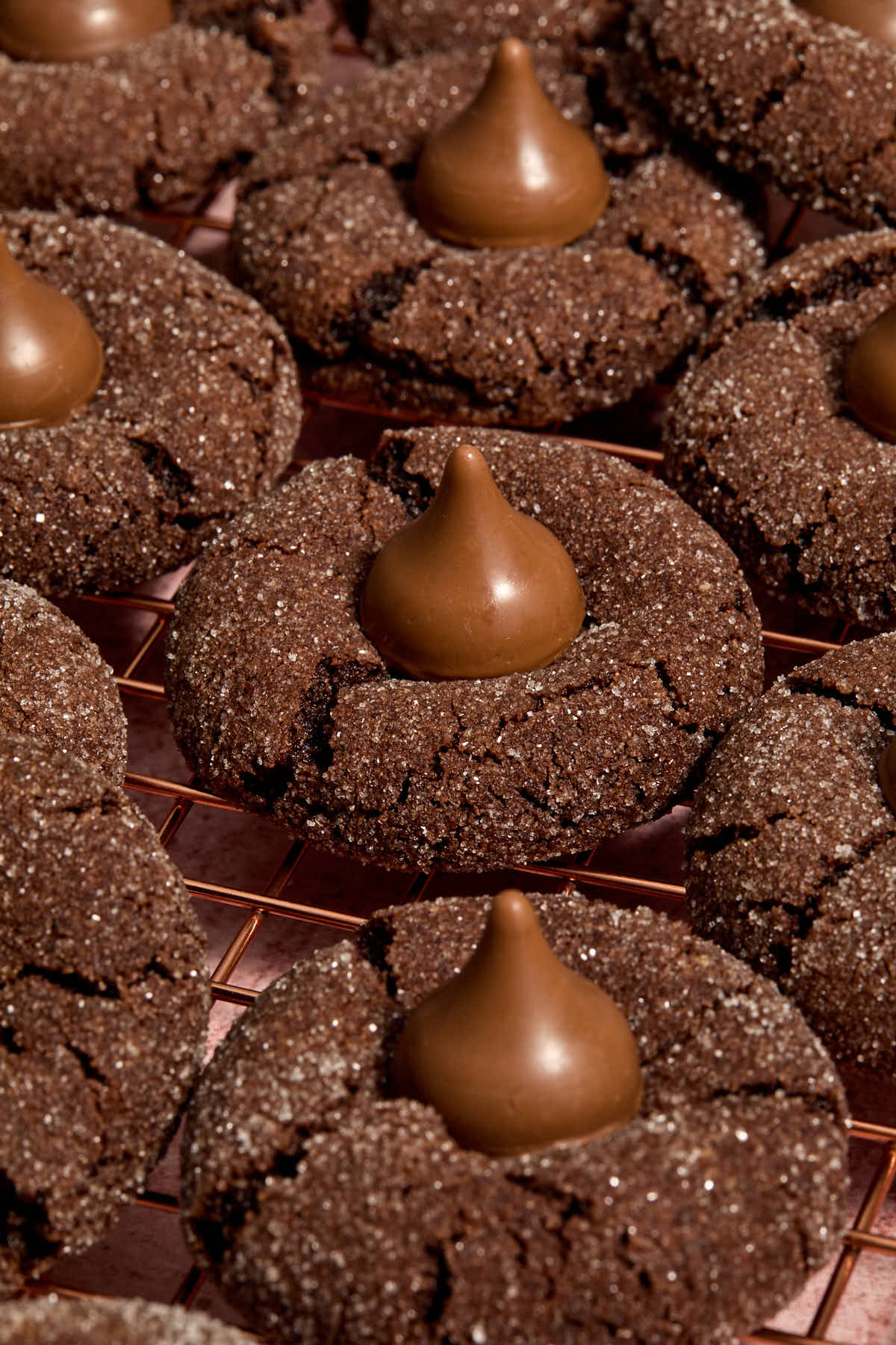 Angled view of cookies cooling on a wire rack.