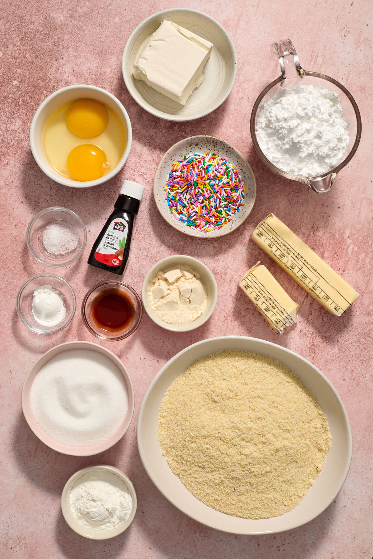 Ingredients for almond flour sugar cookie bars displayed individually.