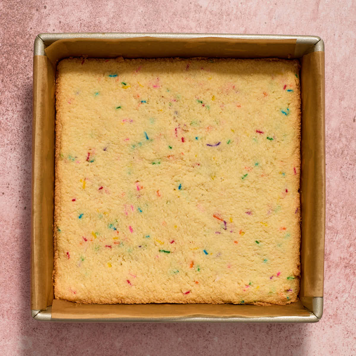 Baked sugar cookie bars in the pan.