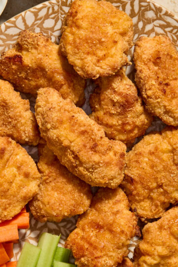 Crispy boneless chicken wings served on a platter.