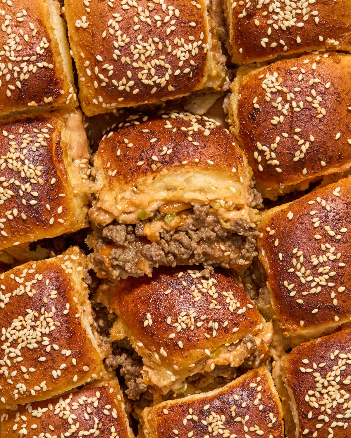 Overhead of sliders close together on parchment paper.