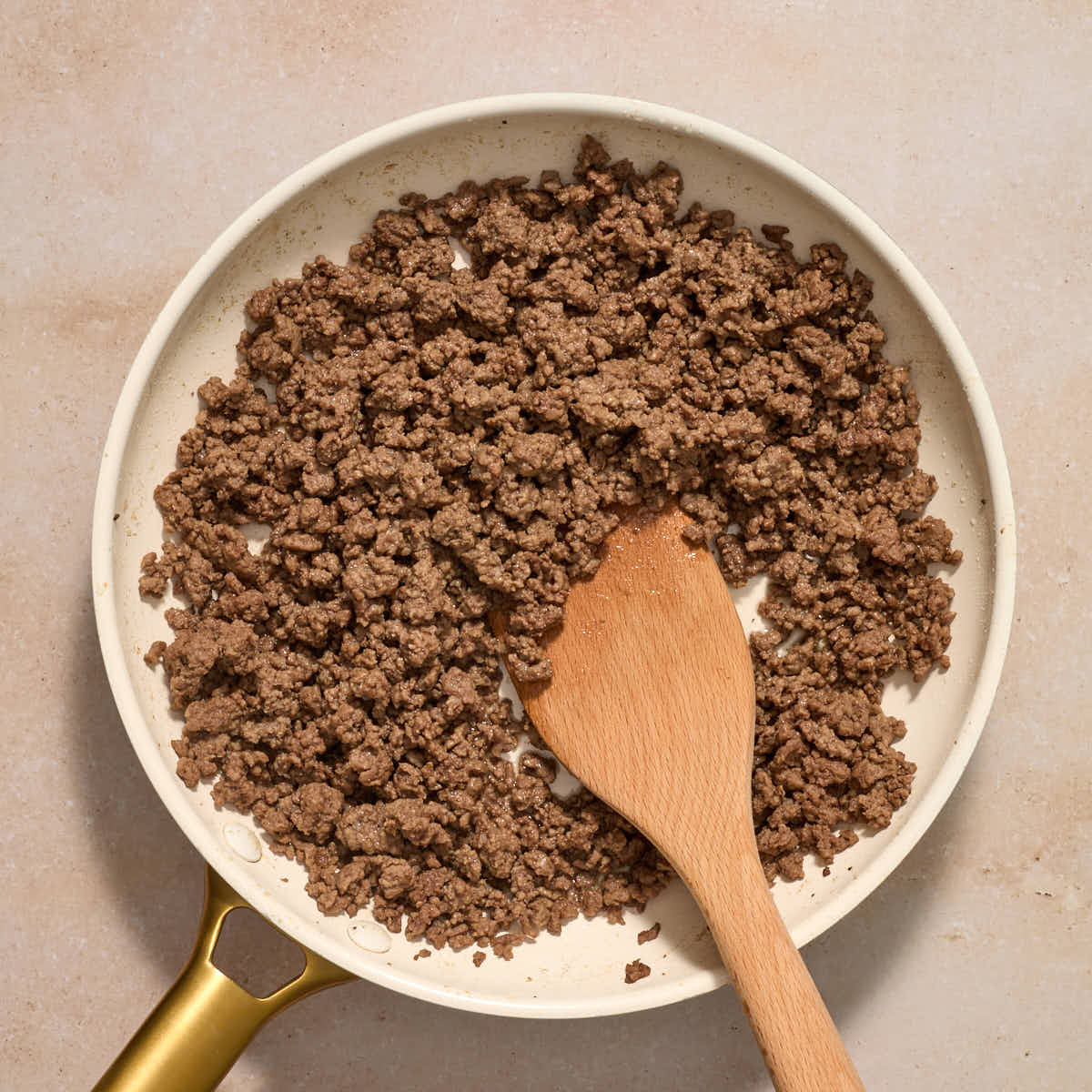 Ground beef cooked in a skillet.