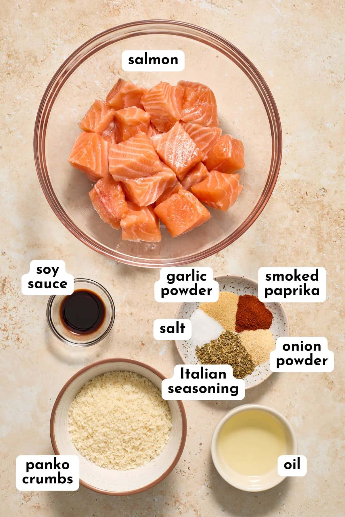 Ingredients to make air fryer salmon bites arranged individually and labeled.