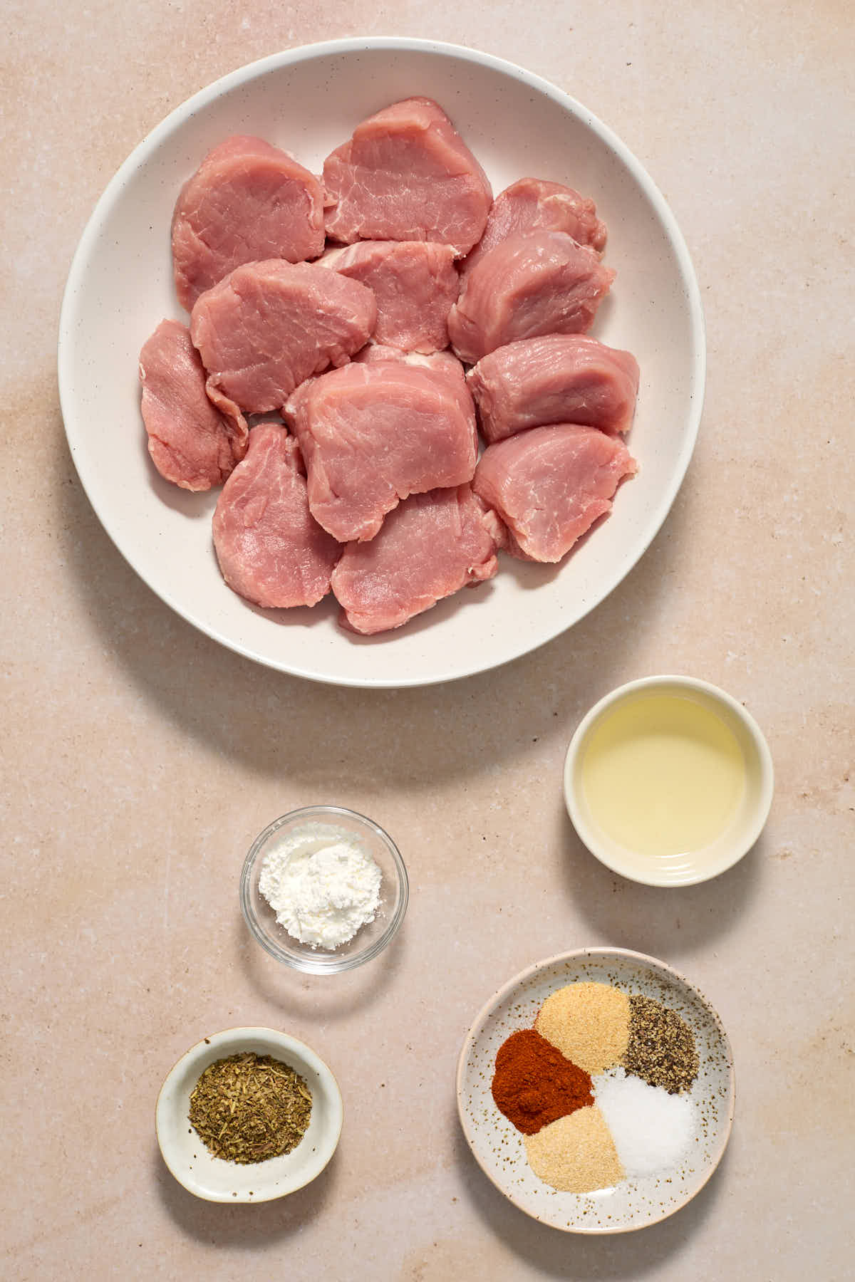 Ingredients to make air fryer pork medallions arranged individually.