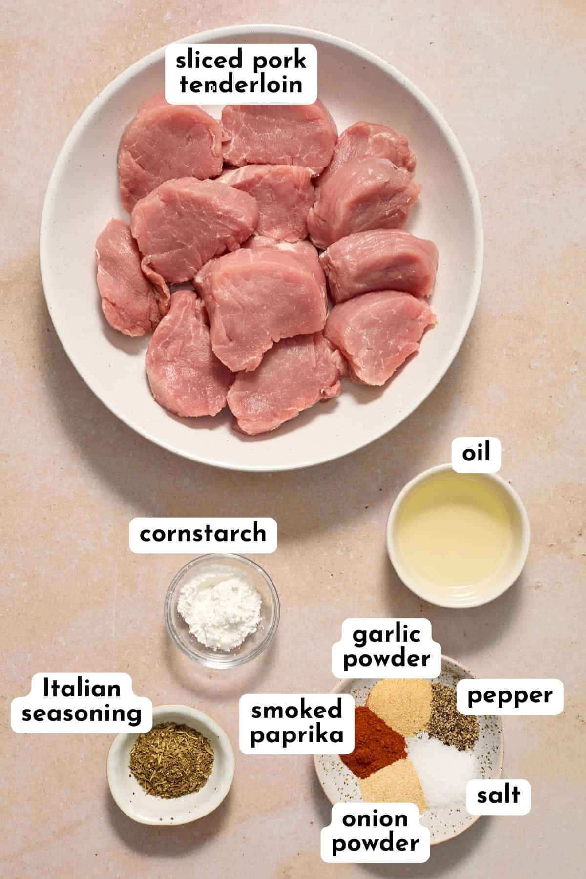 Ingredients to make air fryer pork medallions arranged individually and labeled.