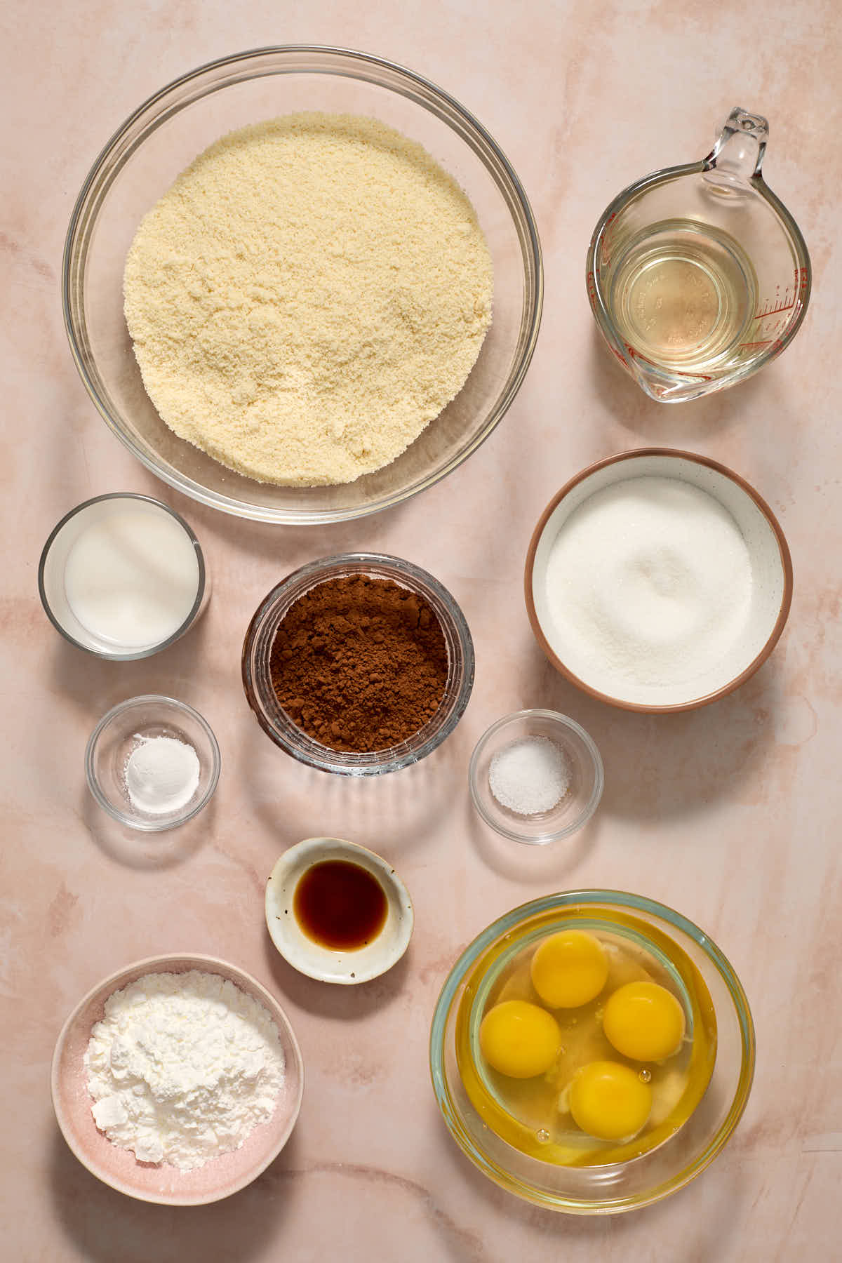 Ingredients to make a chocolate marble loaf arranged in individual dishes.