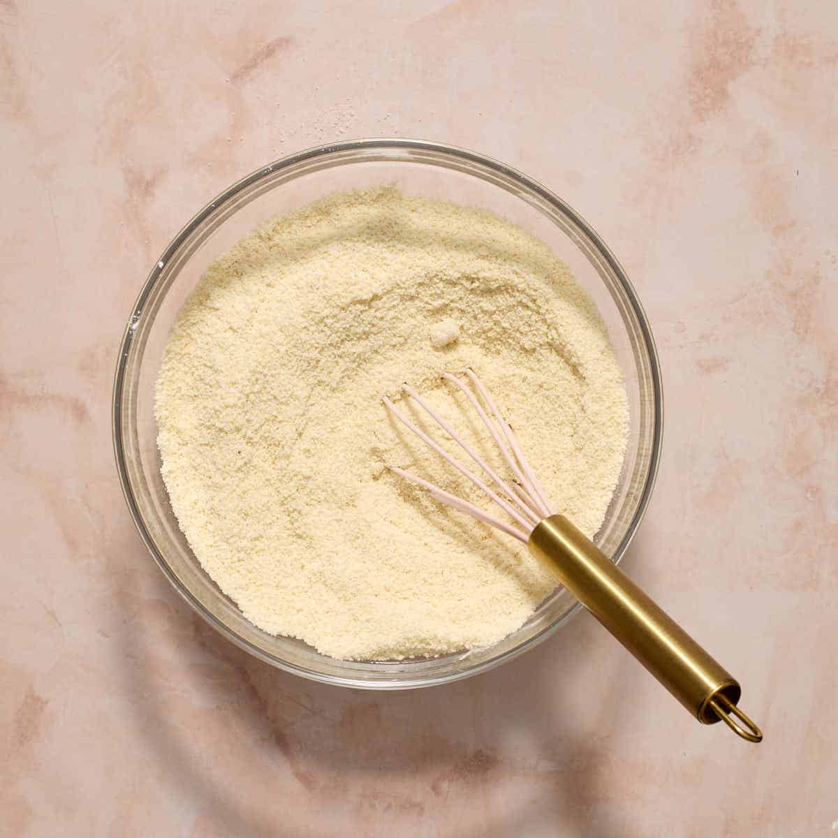 Almond flour, cornstarch, baking powder and salt whisked together in a glass bowl.