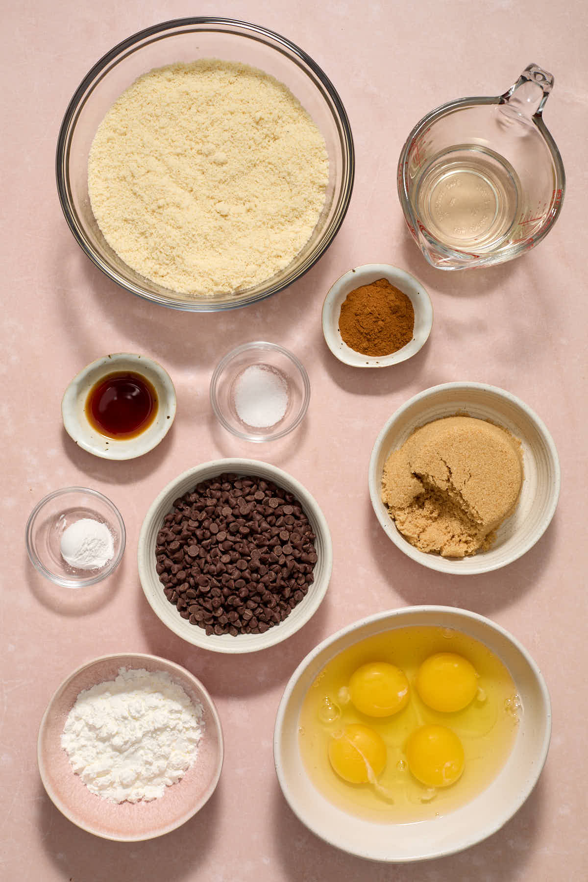 Ingredients to make cinnamon chocolate chip muffins arranged individually.