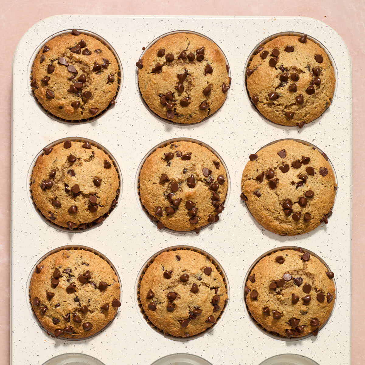 Baked muffins resting in the muffin pan.