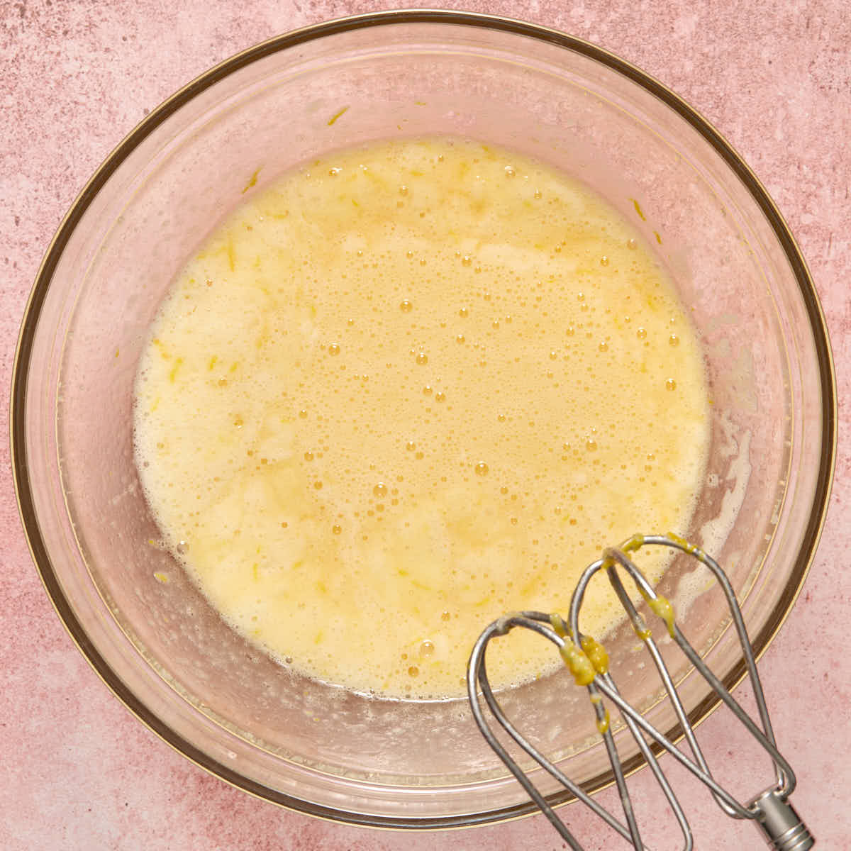 All the wet ingredients mixed together in a glass bowl.