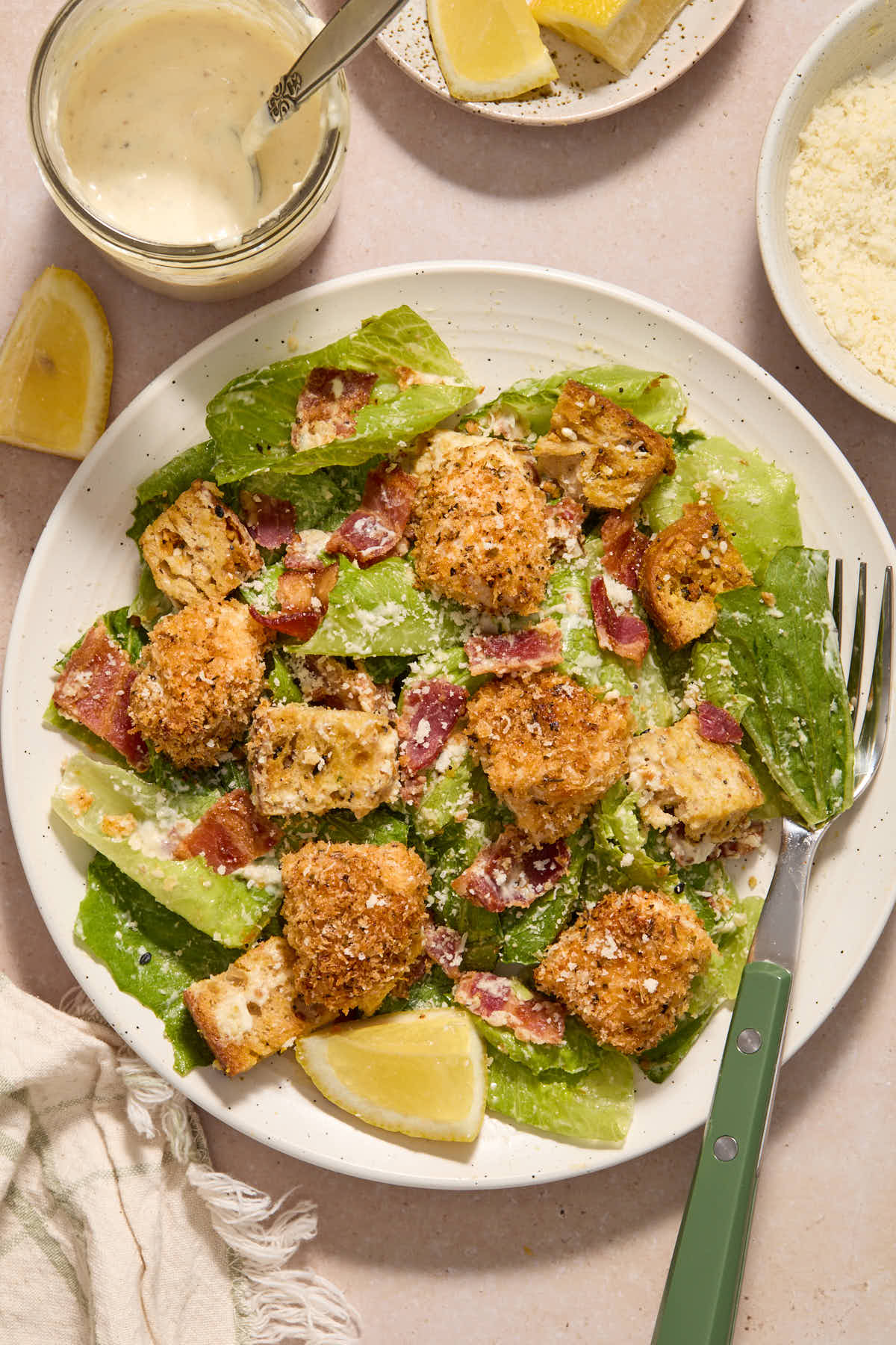 Caesar salad served on a white plate with a fork.