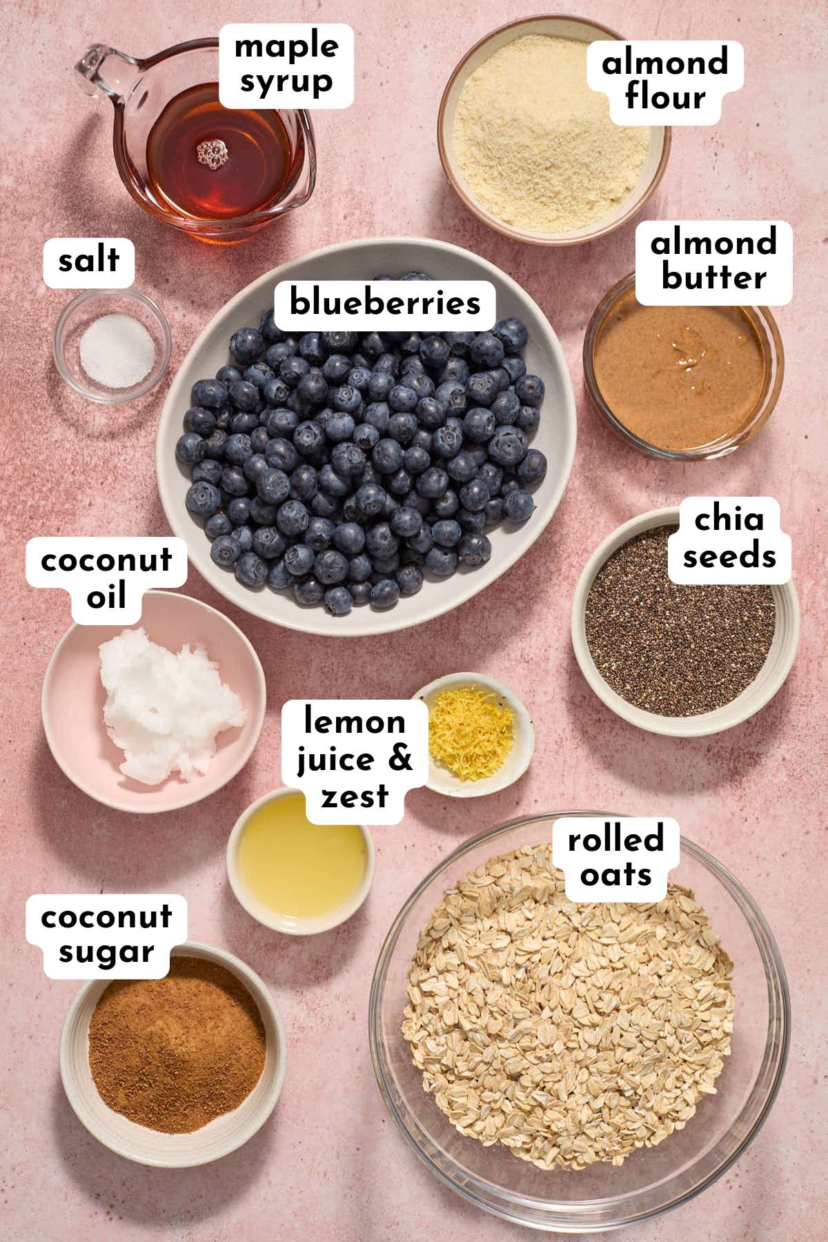 Ingredients to make blueberry breakfast bars arranged individually and labeled.