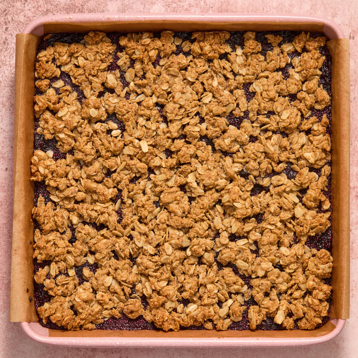 Baked blueberry oat bars in a square pan.