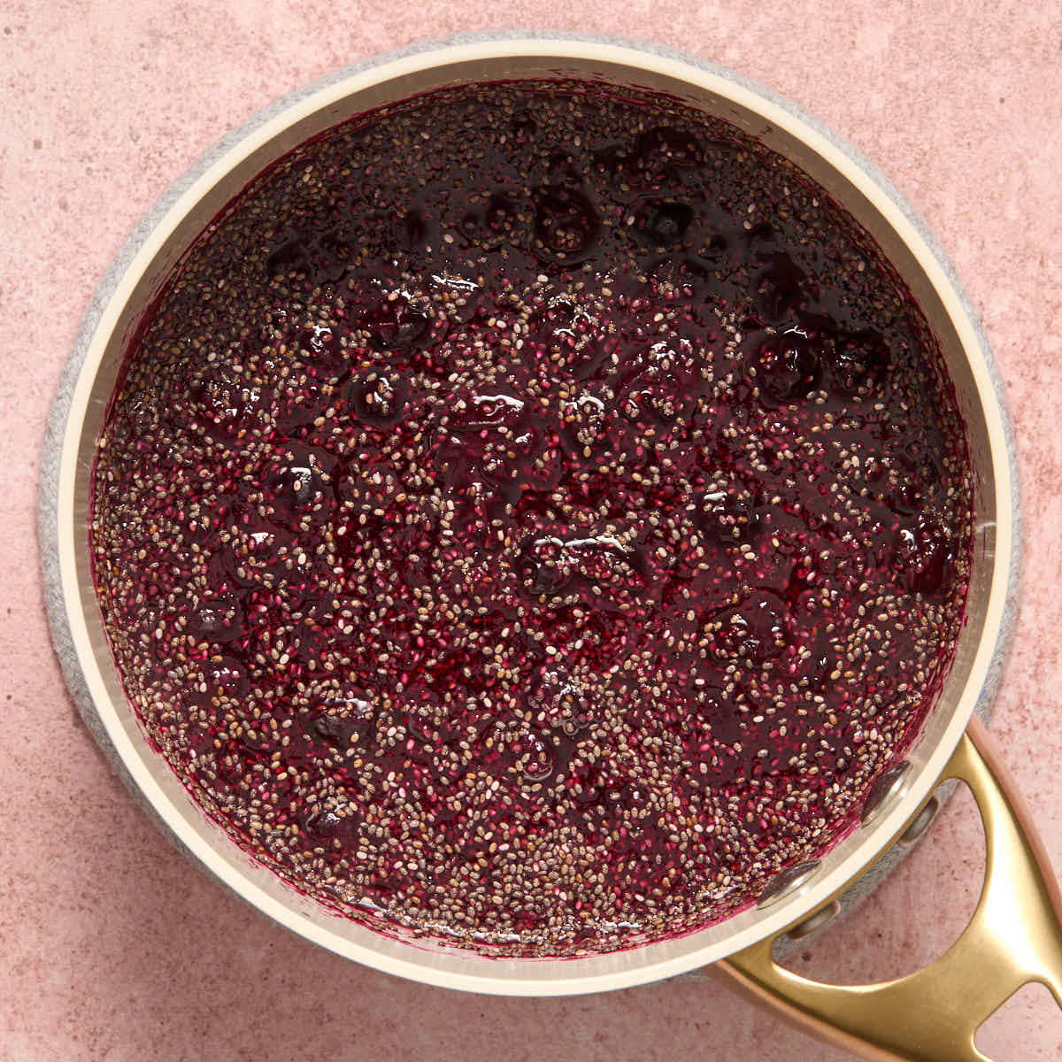 Chia seeds stirred into the cooked blueberry mixture.