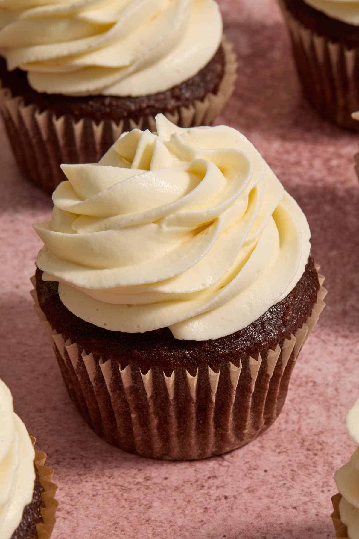 Frosting piped onto a chocolate cupcake.