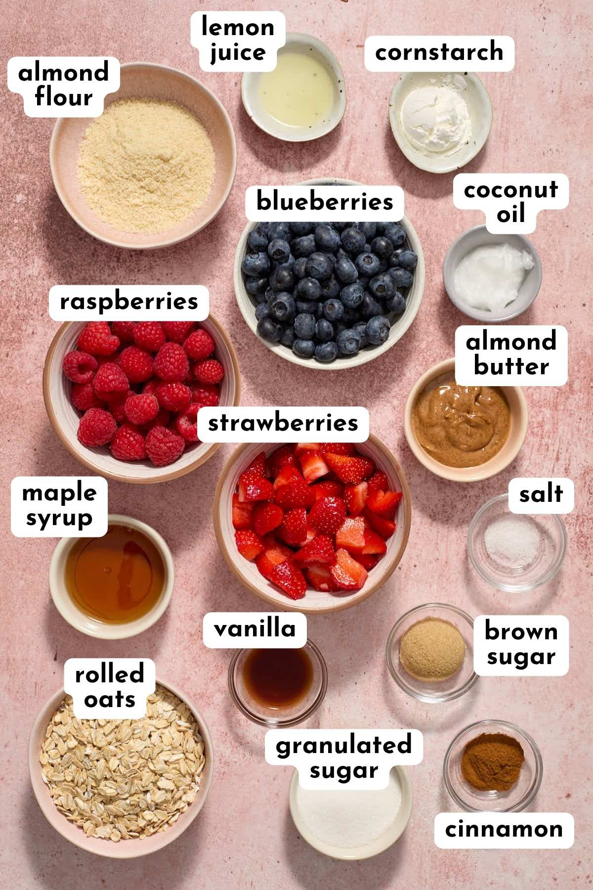 Ingredients to make air fryer berry crisp arranged individually and labeled.