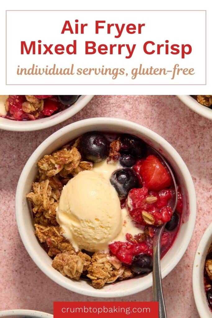 Pinterest image for air fryer berry crisp showing one of the individual crisps in a ramekin.