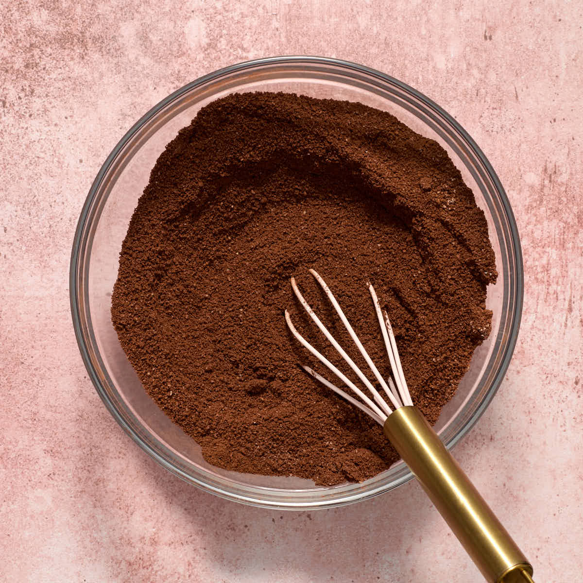 Almond flour, cocoa, baking soda, salt and espresso powder whisked together in a glass bowl.