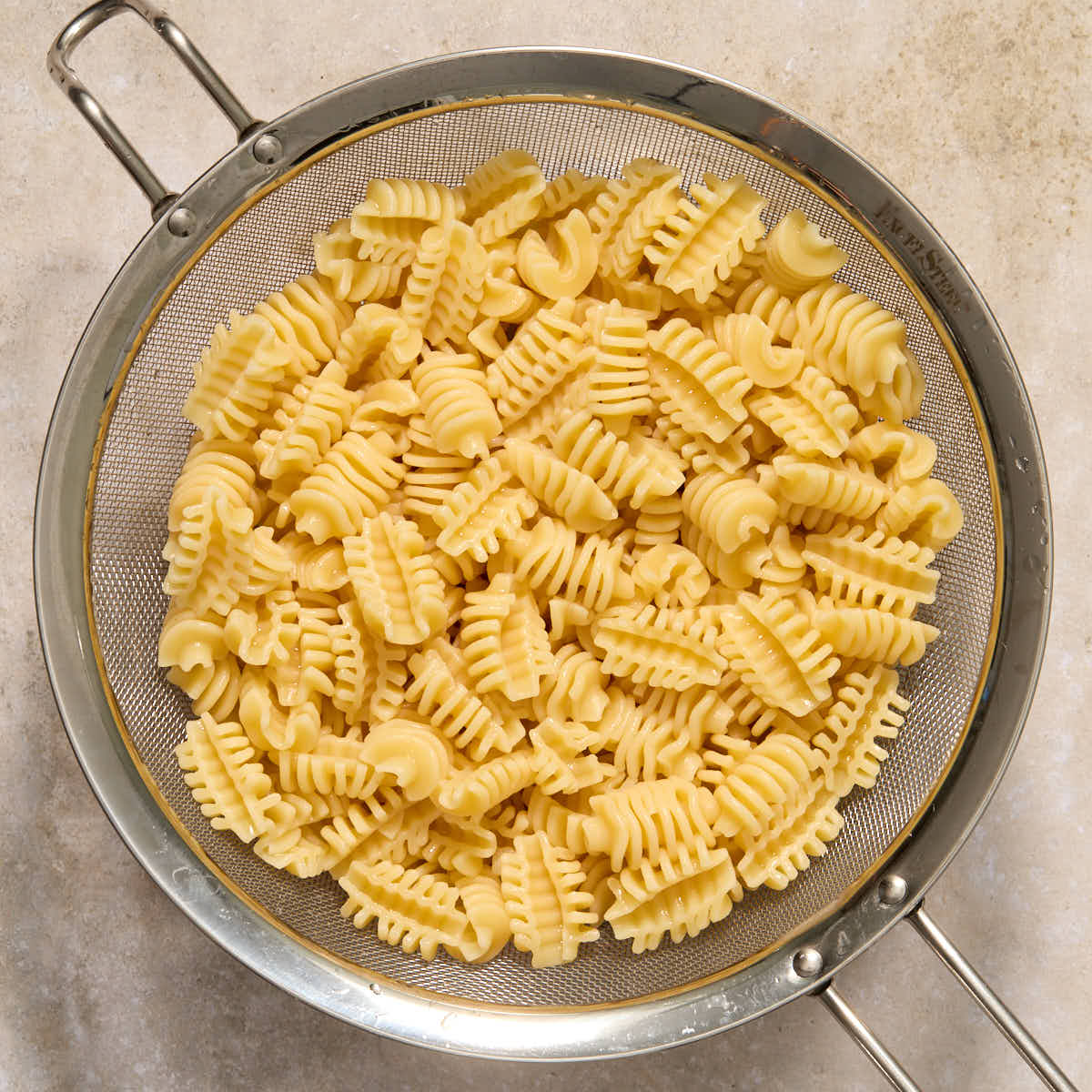 Cooked radiatori pasta in a colander.