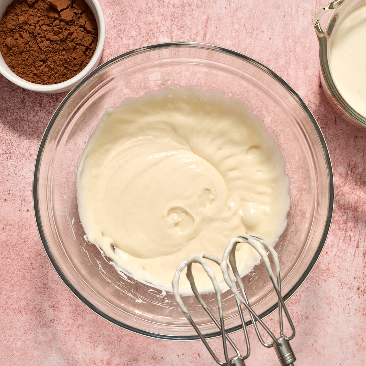 Powdered sugar beaten into the cream cheese until smooth with cocoa and whipping cream on the side.