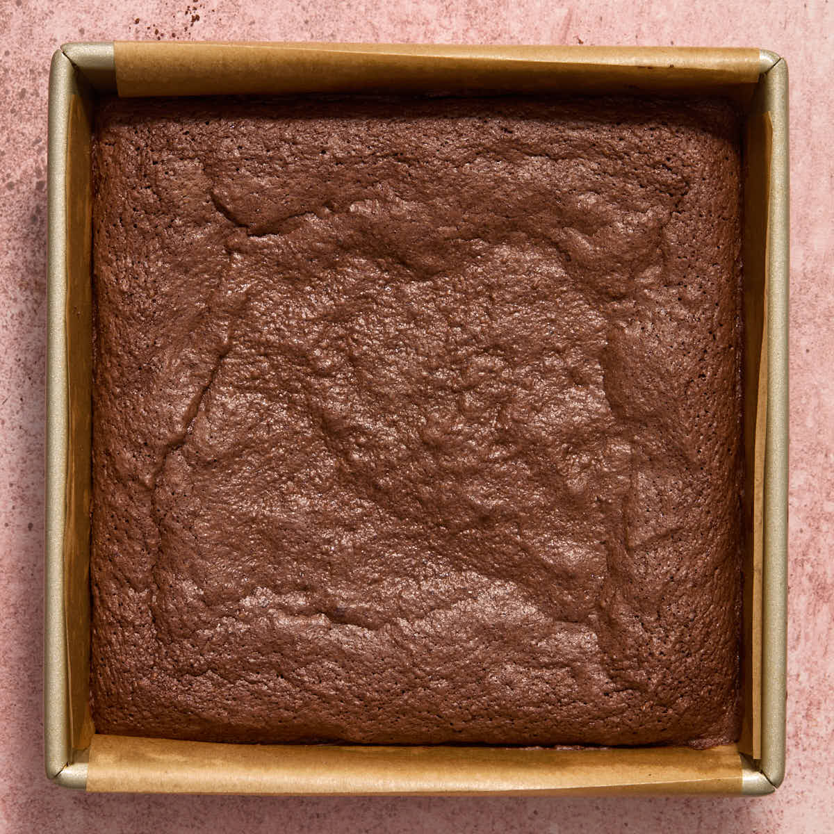 Brownies baked in a square pan.