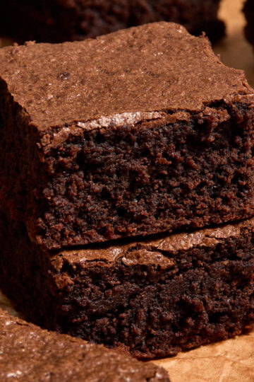 Two almond flour brownies stacked together.
