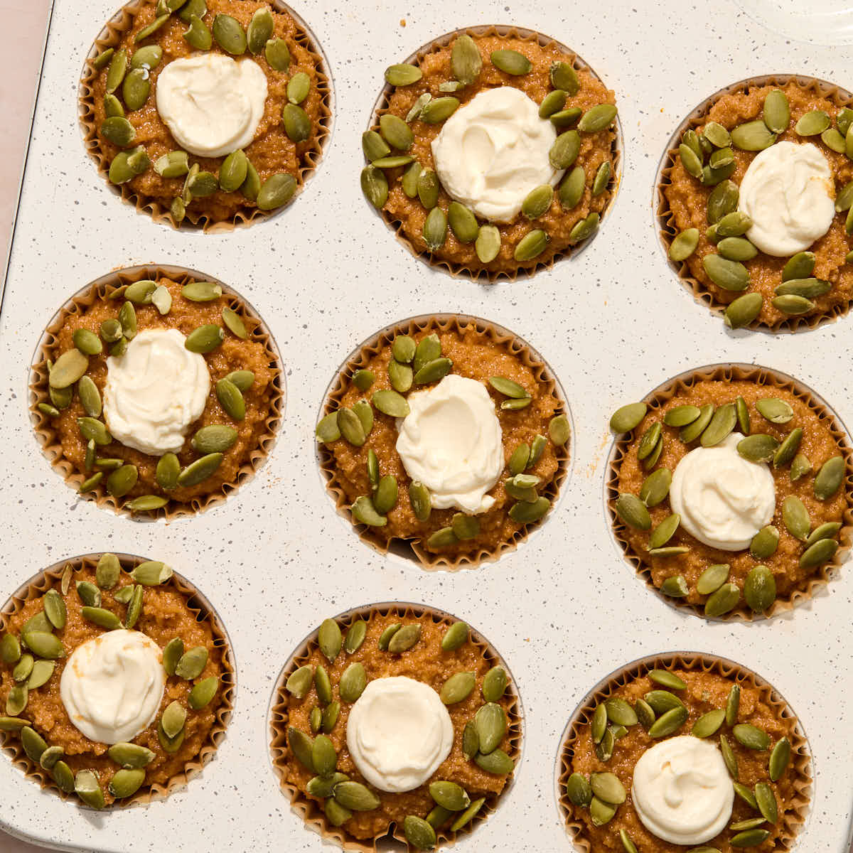 Pumpkin seeds added to the tops of each muffin.
